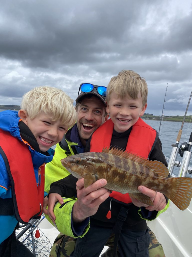 Boat fishing for Wrasse with The School Of Fish